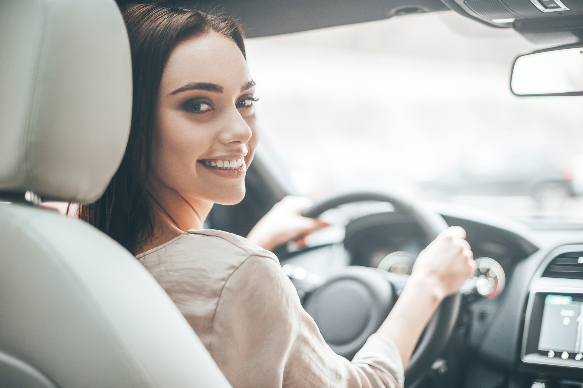 Happy woman driving